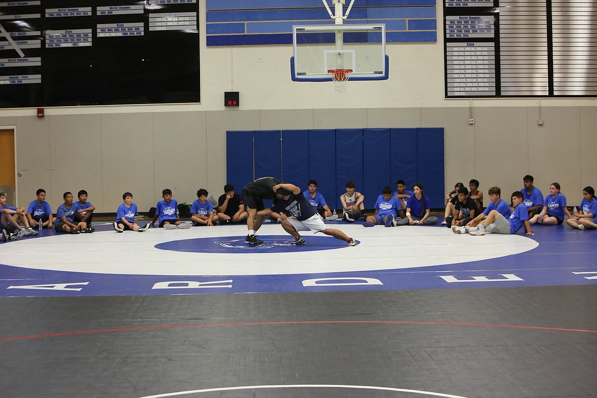 Four-time state champion Chris Castillo came to help instruct wrestlers at the Warden Wrestling Summer Camp.