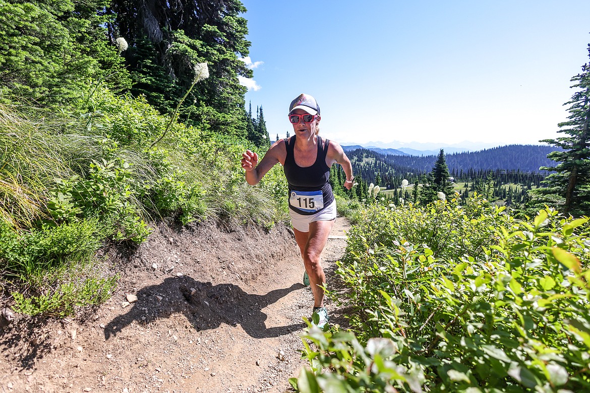 Sarah Fitzgeralds climb the Danny On Trail at Whitefish Mountain Resort Saturday competing in the 40th Annual Big Mountain Run. The race supports Glacier Nordic Club. (JP Edge photo)