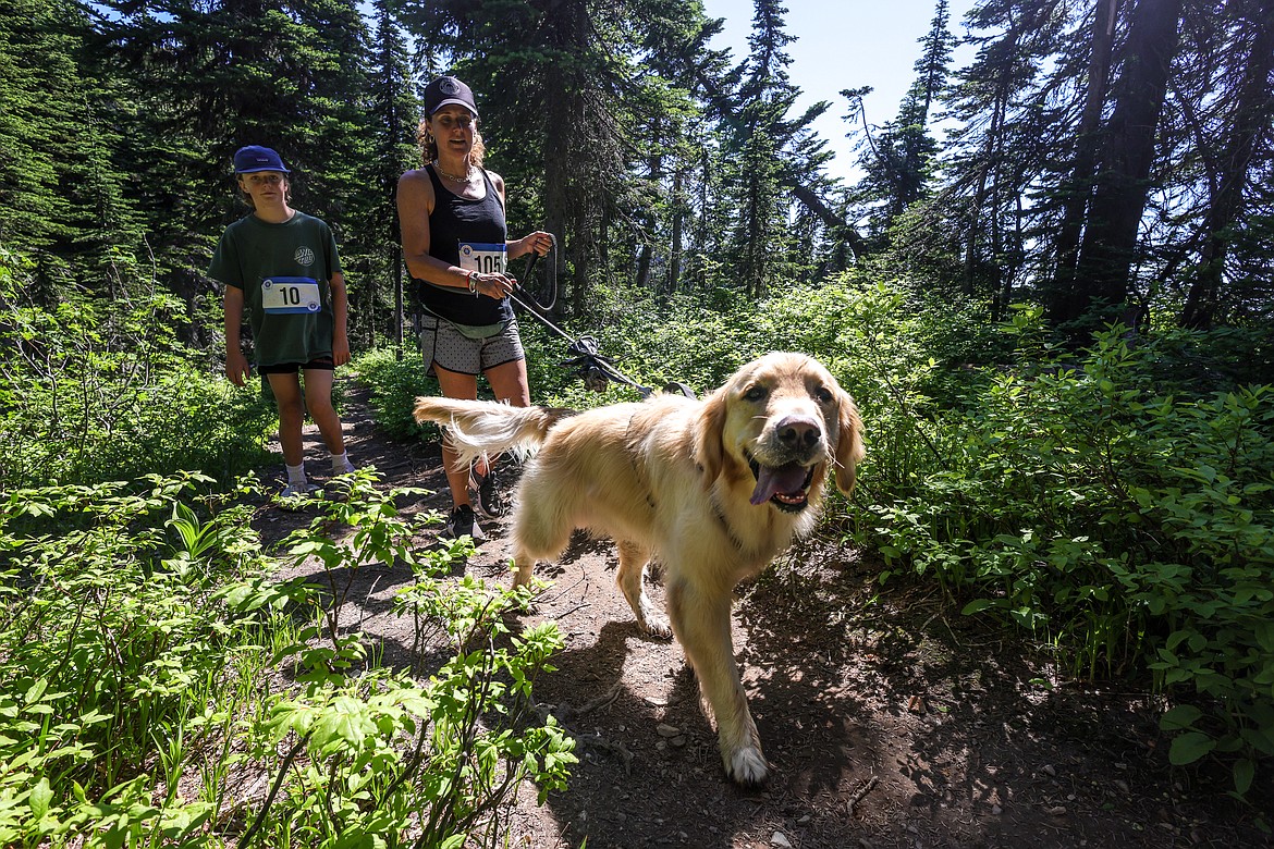 Miles and Chelsea Charles climb the Danny On Trail at Whitefish Mountain Resort Saturday competing in the 40th Annual Big Mountain Run. The race supports Glacier Nordic Club. (JP Edge photo)