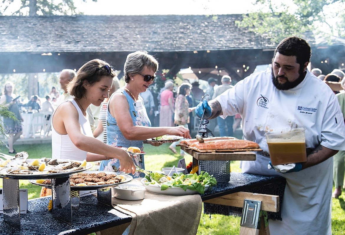 Guests enjoy dinner at the Flathead Valley Community College Foundation’s Festival of Flavors summer event. (Courtesy photo)