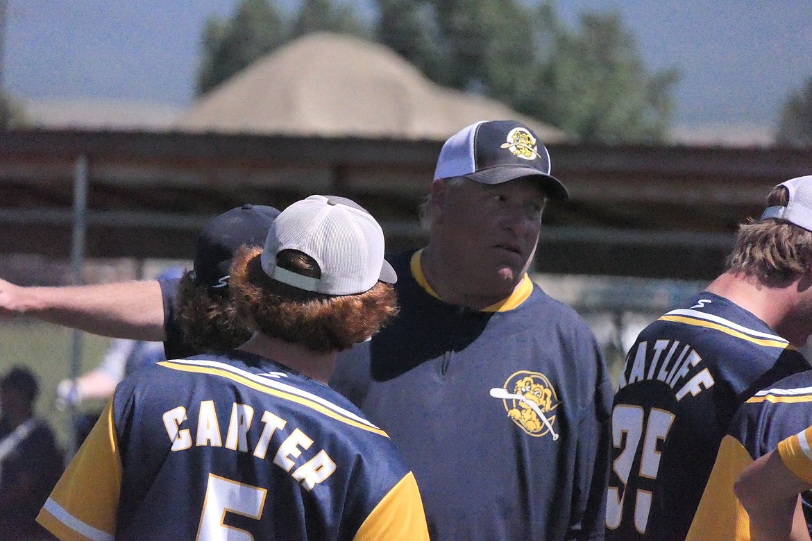 Riverdogs coach Jon Zigler goes over in-game instructions during a home game this year. The Dogs finished the season with a 23-23 record. (Chuck Bandel/VP-MI)