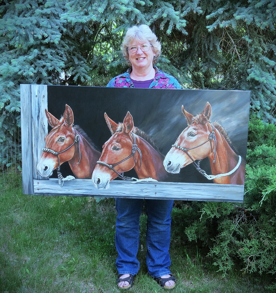 Ilene Paulsen with an original 24” x 48” acrylic titled The Working Class. Eleven artists of different mediums will have their work on display at the Paradise Community Center August 4-6. (Monte Turner/Mineral Independent)