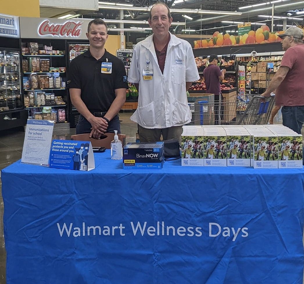 Smelterville Walmart store manager Karl Bonner and pharmacy manager Hank Rauenhorst pose for Walmart Wellness Day last year.