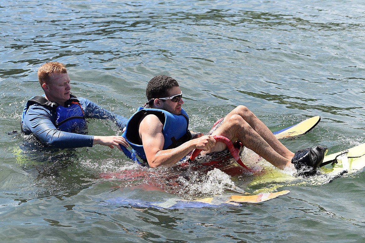 DREAM Adaptive Recreation participant Spencer Yebra is assited by volunteer Jai Chisholm just before taking off on the adaptive water ski on July 21 during the week-long annual Water Sports Program at Echo Lake. (Whitney England/Whitefish Pilot)