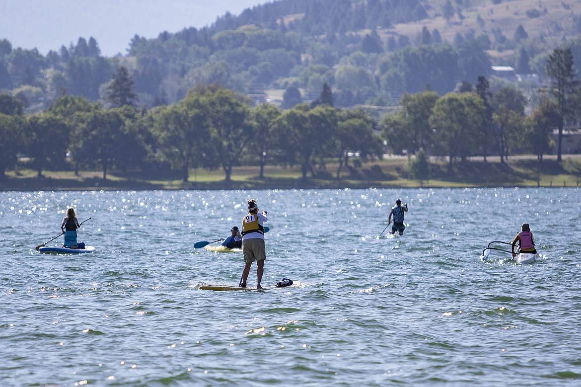 Paddlers make their way to the next check point on Flathead Lake. (Rob Zolman/Lake County Leader)