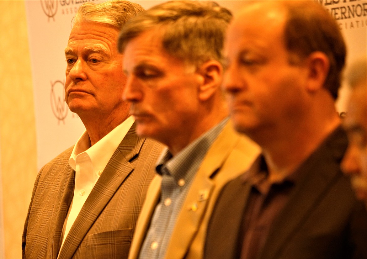 Gov. Brad Little, left, stands next to Wyoming Gov. Mark Gordon, center, and Colorado Gov. Jared Polis during a press conference prior to the opening of the Western Governors' Association annual meeting at The Coeur d'Alene Resort on Tuesday.