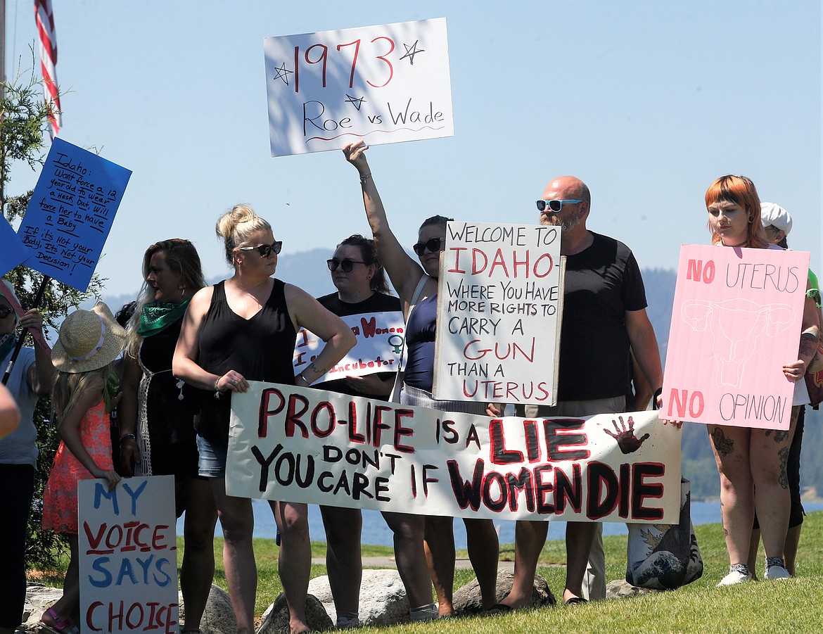 A group of about 50 people protests at Independence Point on Tuesday. The Kootenai County Women’s March organized the event, which targeted the overturn of Roe v. Wade and also Gov. Brad Little's signing of the "Fetal Heartbeat Bill," which bans abortions after a baby’s heartbeat is detected. Little is hosting the Western Governors Association's annual meeting that started Tuesday at The Coeur d'Alene Resort.