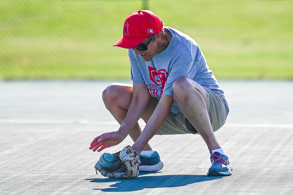 Jamey Herron of the Angels Grey team fields a grounder during a Miracle League of Northwest Montana game against the Pirates at Kidsports Complex on Tuesday, July 27. (Casey Kreider/Daily Inter Lake)