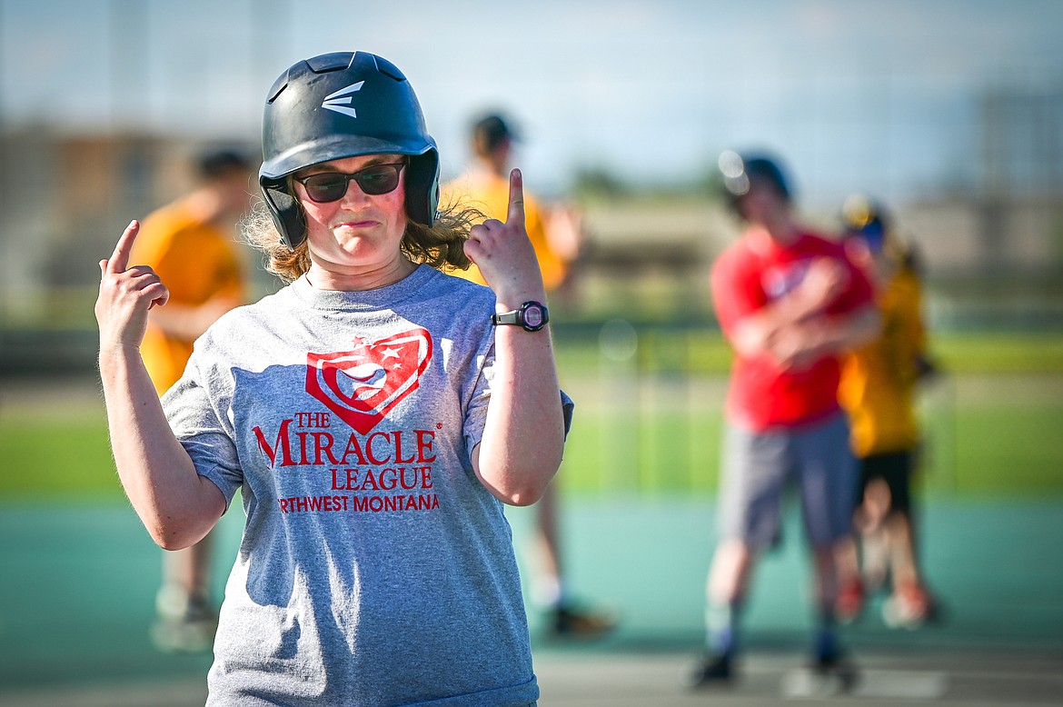 Carleen Koch with the Angels Grey team celebrates as she advances to third base as her team plays the Pirates in the Miracle League of Northwest Montana at Kidsports Complex on Tuesday, July 26. (Casey Kreider/Daily Inter Lake)