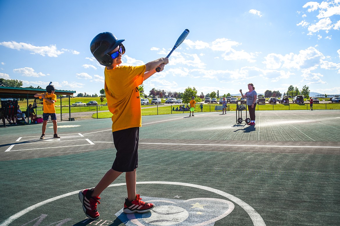 Ryley Shiell swings a bat in the on-deck circle as the Pirates and Angels Grey play in the Miracle League of Northwest Montana at Kidsports Complex on Tuesday, July 26. (Casey Kreider/Daily Inter Lake)