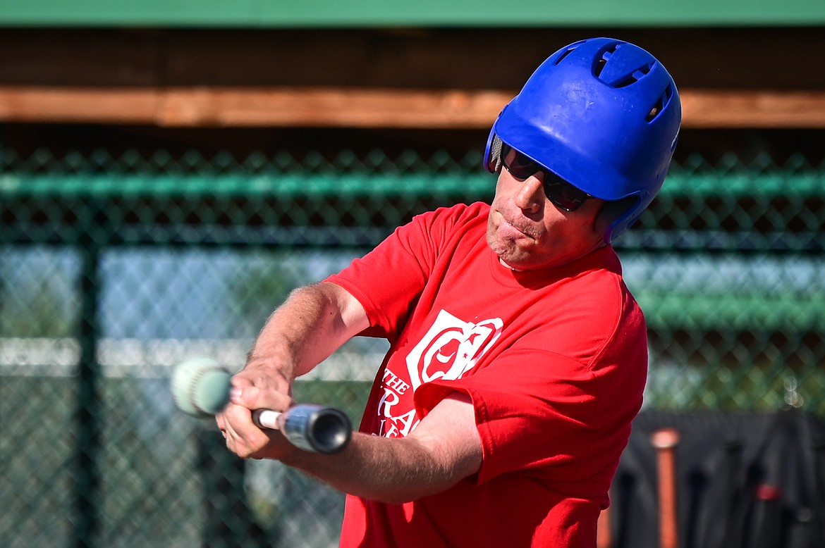Ryan Trout connects on a home run as the Angels Grey play the Pirates in a Miracle League of Northwest Montana game at Kidsports Complex on Tuesday, July 26. (Casey Kreider/Daily Inter Lake)