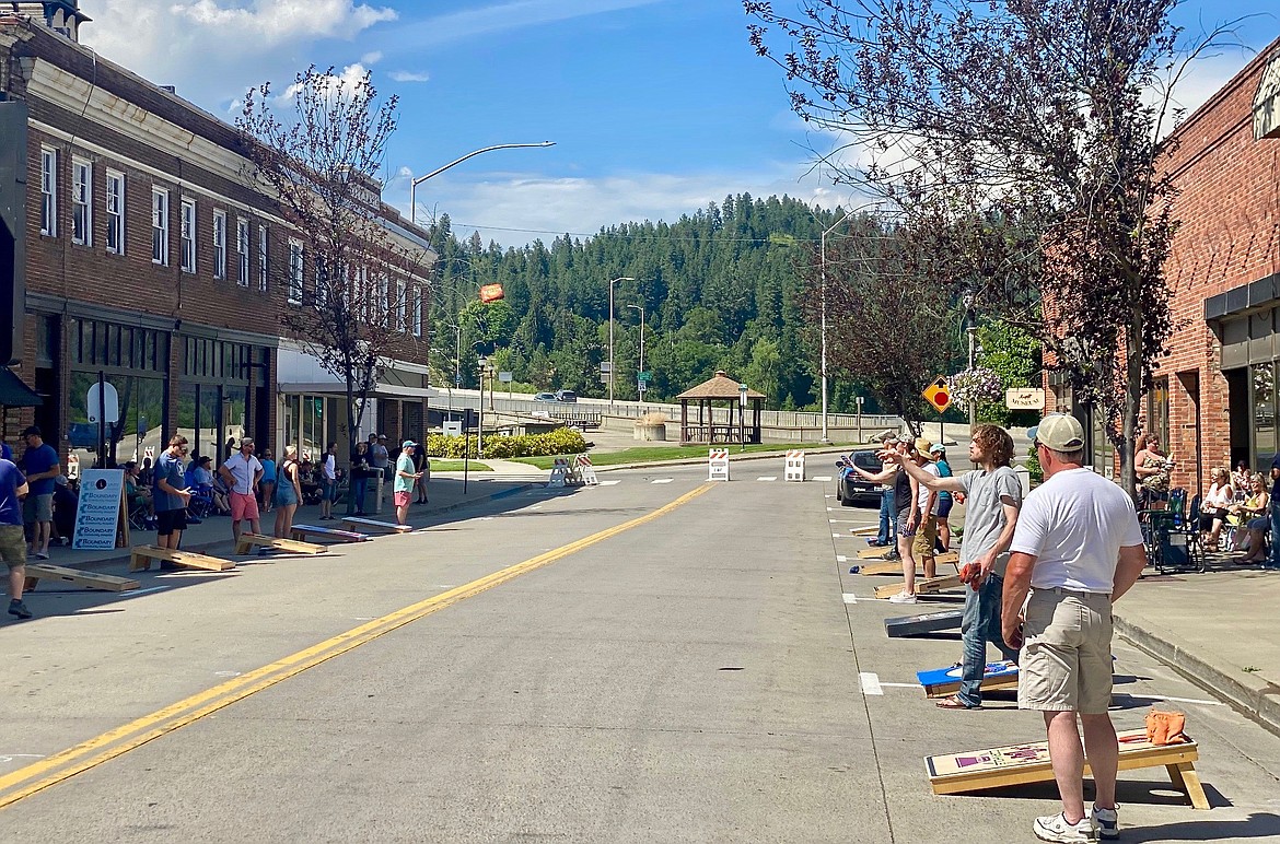 Participants in the Kootenai River Days corn hole tournament played in front of city hall for hours.