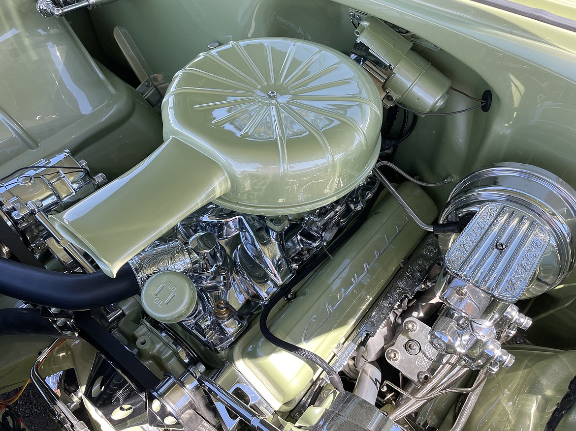Details of the engine — including the chromework — of Dillon Arcega’s 1956 Chevrolet Bel Air lowrider. Despite how clean the engine is, Arcega said he drives each of his four lowriders once a week, as well as driving them to and from shows.
