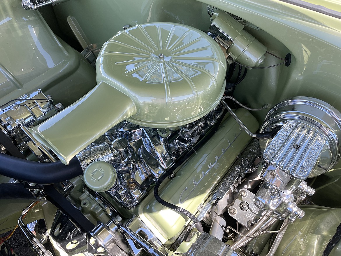 Dillon Arcega finished wiping off some of the chrome on his customized 1956 Chevrolet Bel Air lowrider.