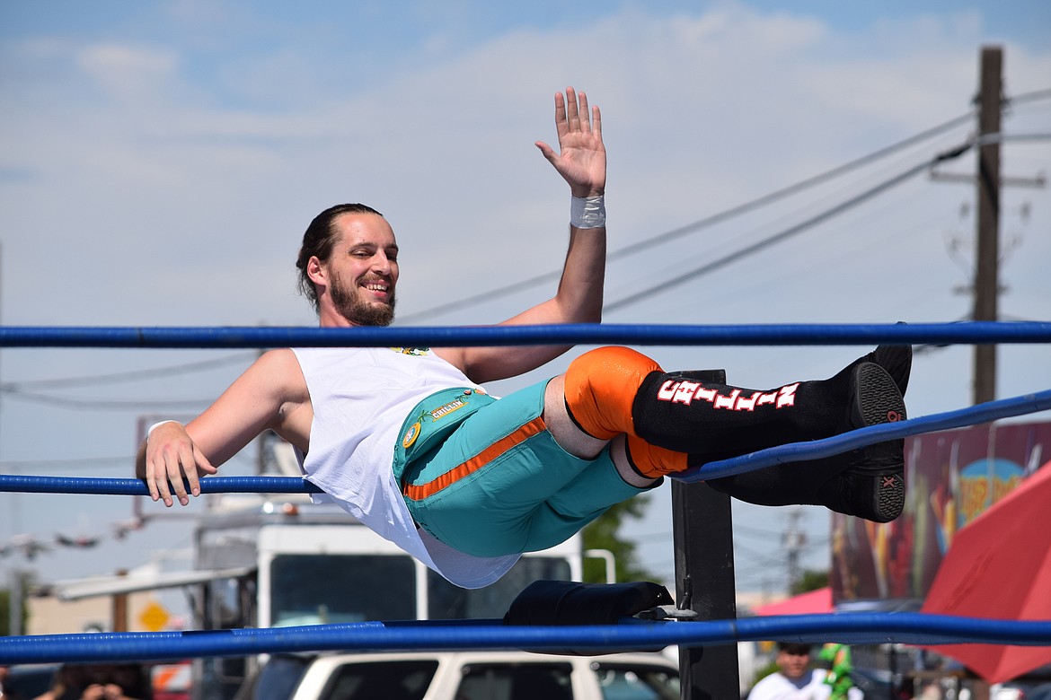 Some Dude Chillin chills and waves to the crowd before his Lucha Libre match on Saturday.