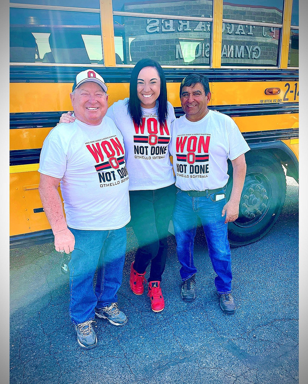 Jenny McCourtie, middle, poses with Othello softball coaches Mike Jensen, left, and Rudy Ochoa, right. Jensen and Ochoa served as coaches for McCourtie when she was in high school.