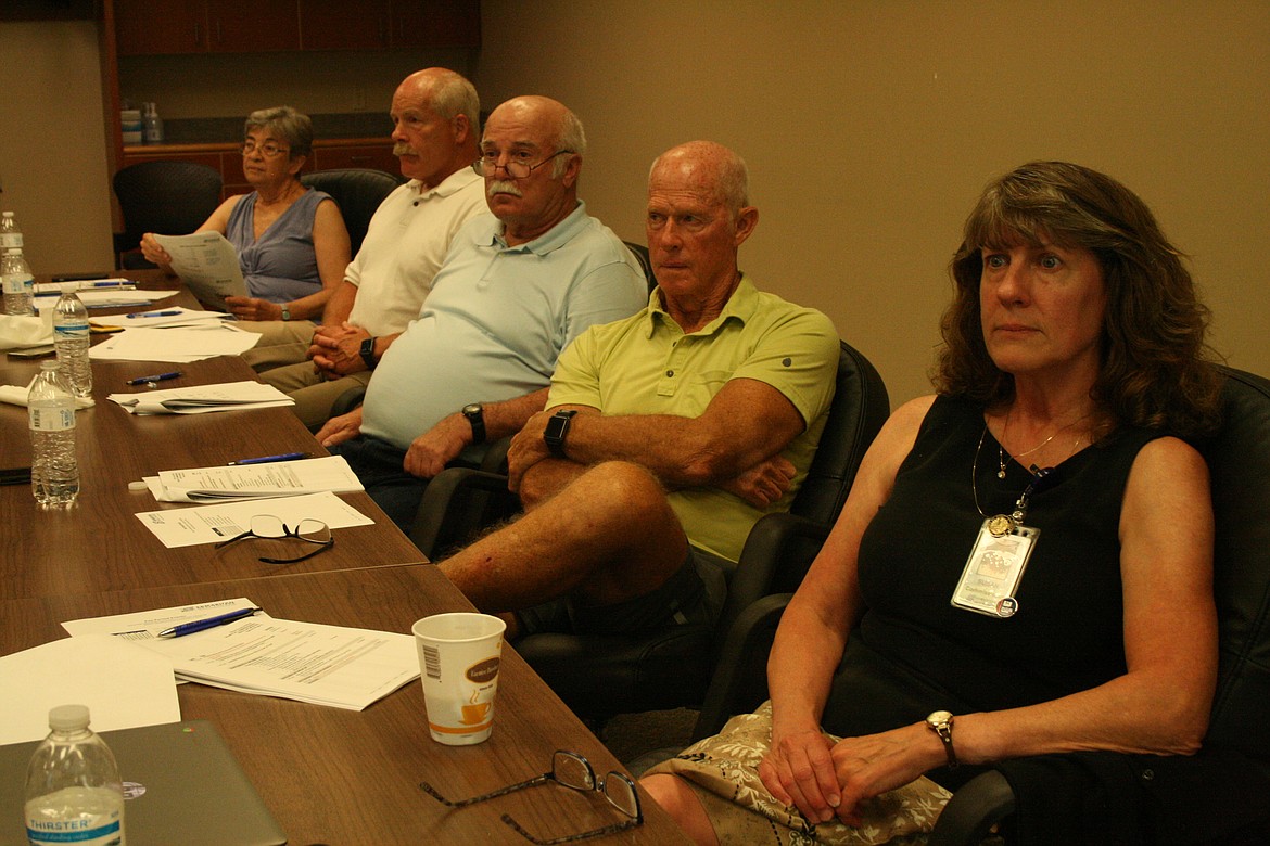 Samaritan Hospital commissioners (from left) Katherine Christian, Alan White, Tom Frick, Dale Paris and Susan Carbon listen to a presentation on the current construction market, and its effect on building a new Samaritan Hospital, during a Tuesday meeting.