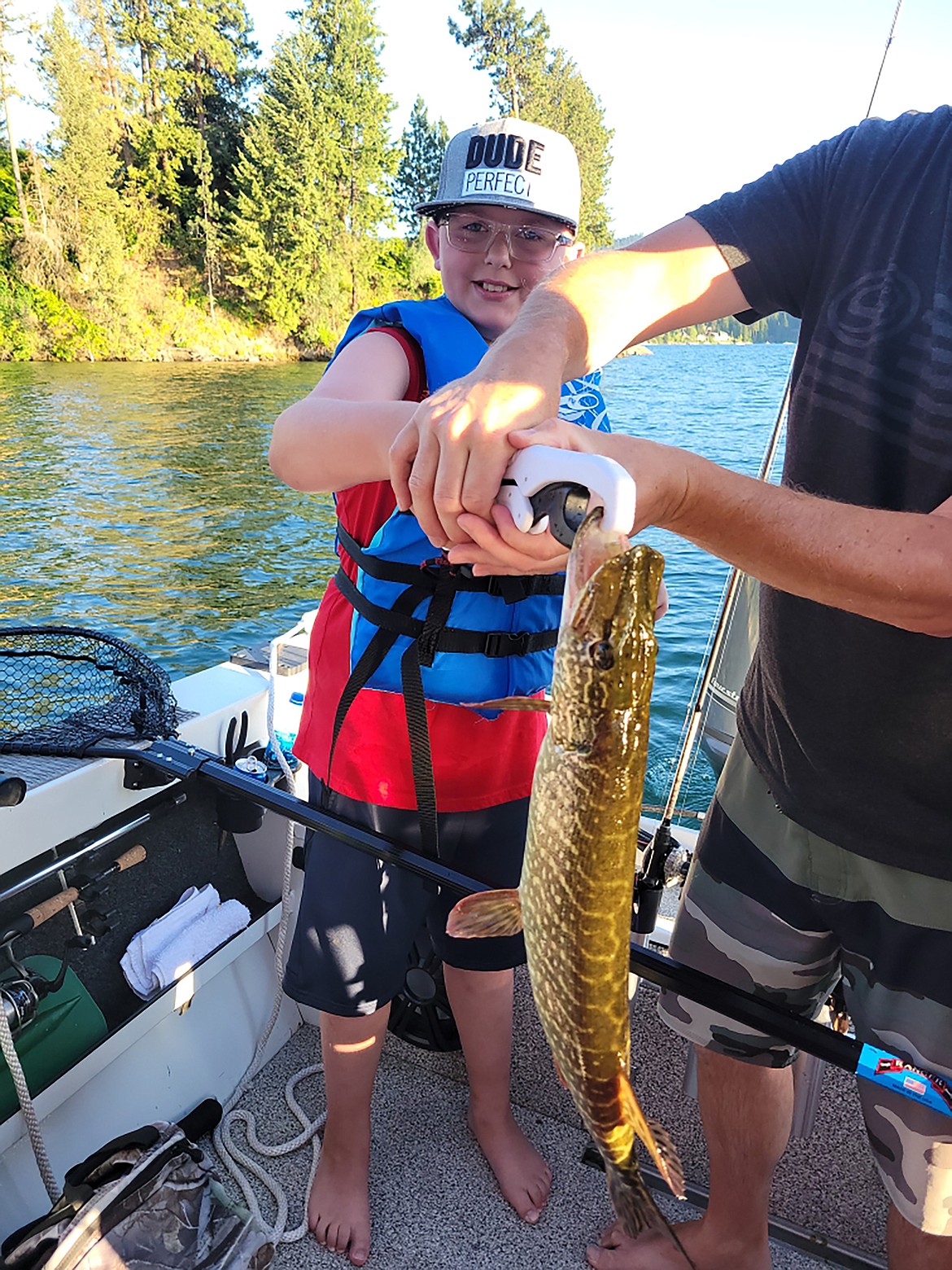 Carson Eisenacher, almost 11, his first pike on a recent outing on Hayden Lake — the same day that his cousin also caught a big pike.