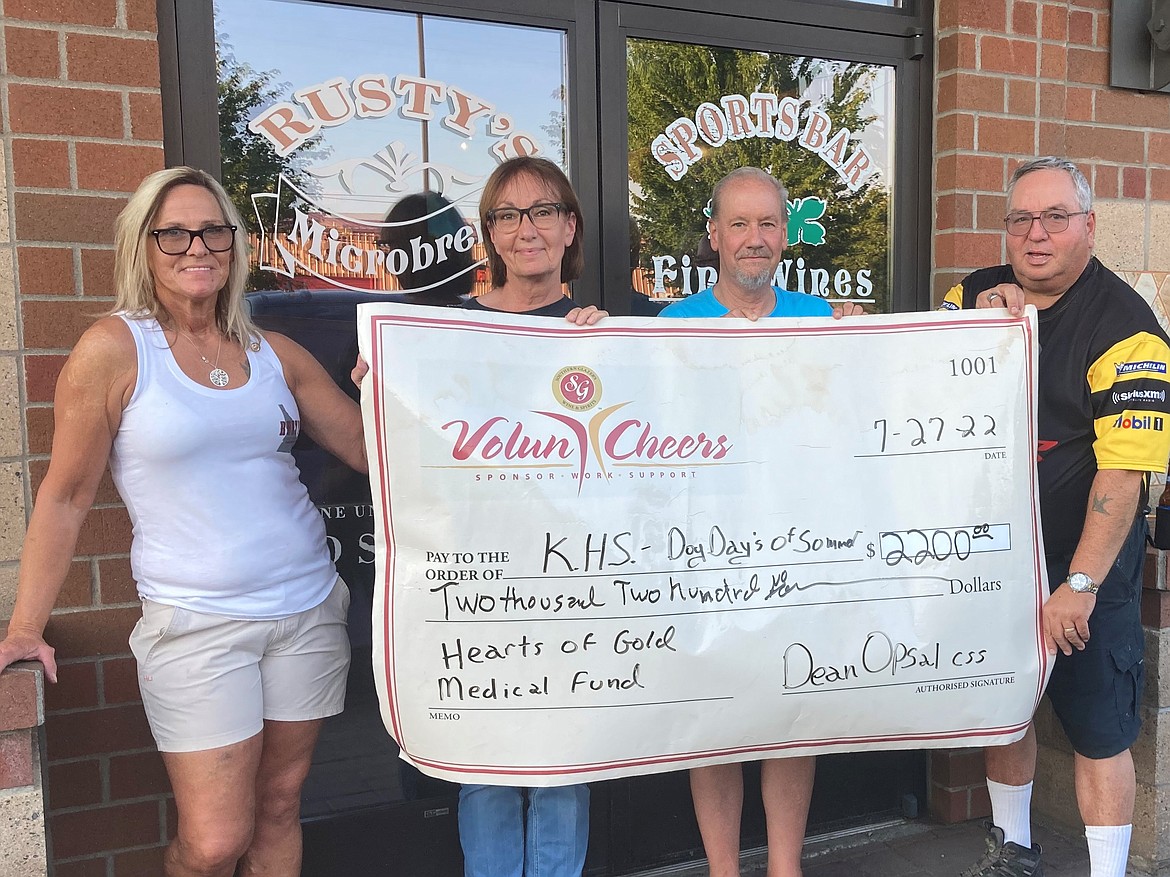 Kootenai Humane Society (Companions Animal Center) received $2,200 for the Hearts of Gold Medical Fund from the "Dog Days of Summer" event at Rusty's Sports Bar in Hayden on July 27. From left: Kelly Jo Arnold; general manager Rusty's; Vicky Nelson, KHS; Rick Gittel, owner Rusty's; and Dean Opsal, CSS Southern Glazers Wine & Spirits Volun Cheers Ambassador for Idaho.