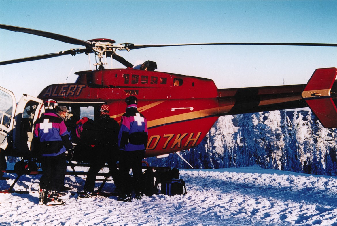 The Logan Health A.L.E.R.T. helicopter performs a mountaintop rescue. (Photo courtesy of Logan Health)
