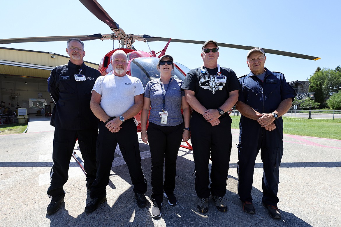 The A.L.E.R.T. crew poses for a photo between calls July 27, including registered nurse Leon DeLong, flight paramedic Reece Roat, program coordinator Angela Mielka, registered nurse Travis Willcut and rotor wing pilot Daron Larsen. (Jeremy Weber/Daily Inter Lake)