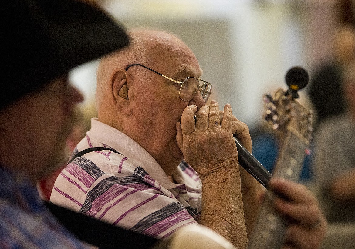 Wally Betz played his harmonica alongside other musicians at a Friday night jam session at The Silver Lake Mall in 2018. LOREN BENOIT/Press file.