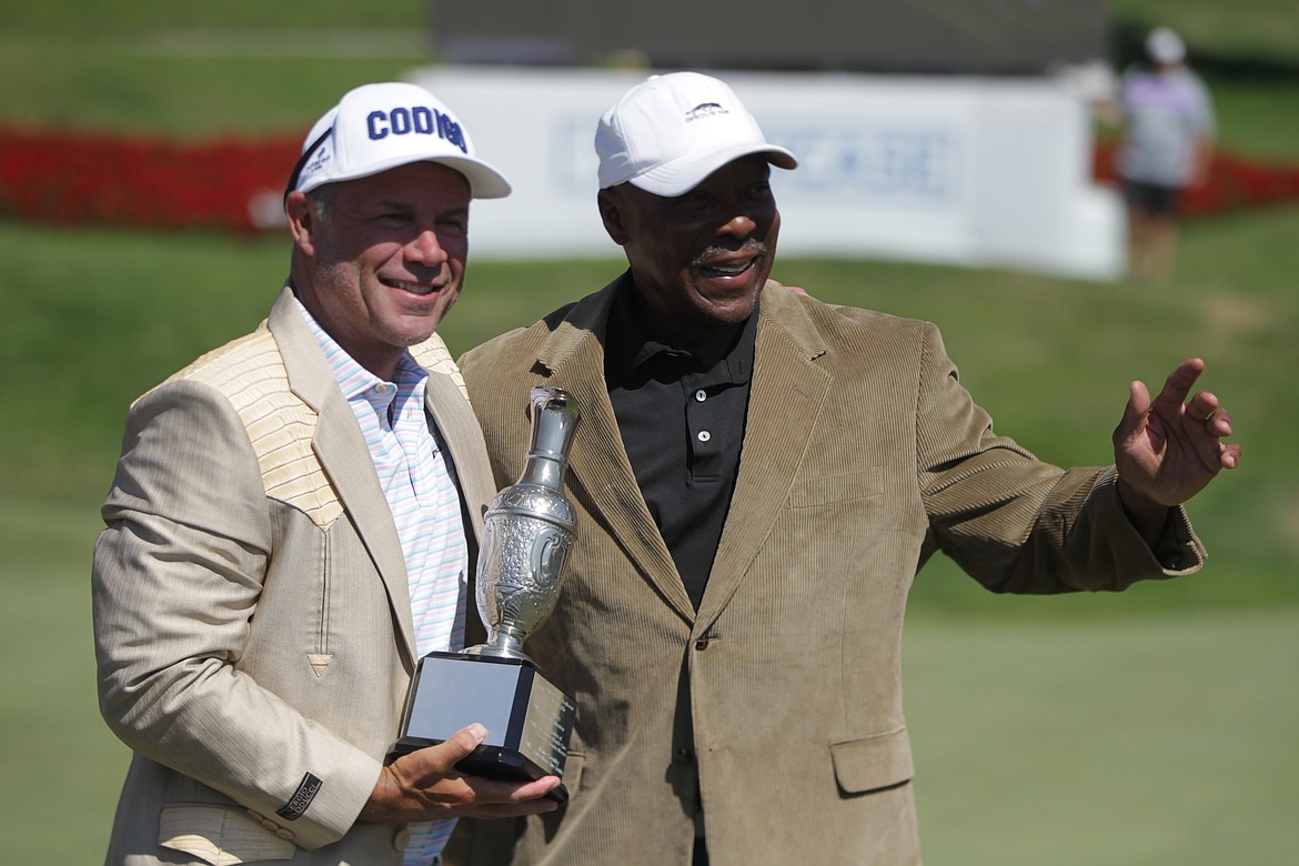 JASON ELLIOTT/Press
Former NHL and Spokane Chief great Ray Whitney and former MLB player Vince Coleman celebrate after winning titles at the Showcase on Saturday at The Coeur d'Alene Resort Golf Course.