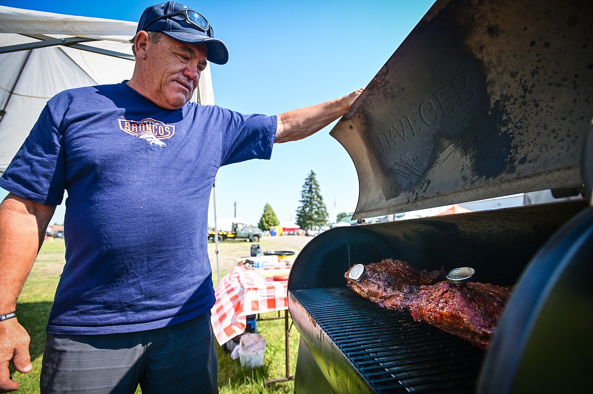 Denny Falcon from the team Totally Sauced started cooking his 12 lb. brisket at around 6 a.m. at the Knights of Columbus Brisket Showdown at the Flathead County Fairgrounds on Saturday, July 30. (Casey Kreider/Daily Inter Lake)