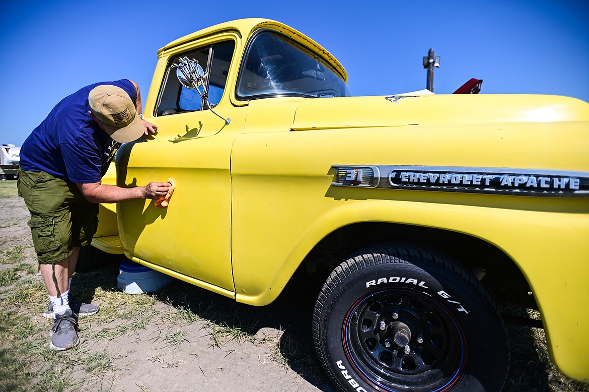 Tom Warden polishes up his 1959 Chevy Apache pickup at the Knights of Columbus Brisket Showdown at the Flathead County Fairgrounds on Saturday, July 30. (Casey Kreider/Daily Inter Lake)