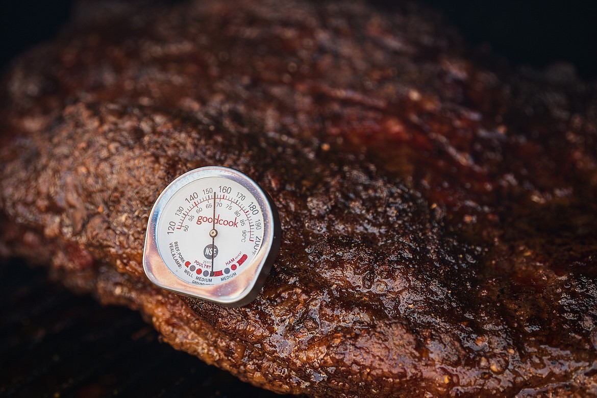 Denny Falcon from the team Totally Sauced started cooking his 12 lb. brisket at around 6 a.m. at the Knights of Columbus Brisket Showdown at the Flathead County Fairgrounds on Saturday, July 30. (Casey Kreider/Daily Inter Lake)