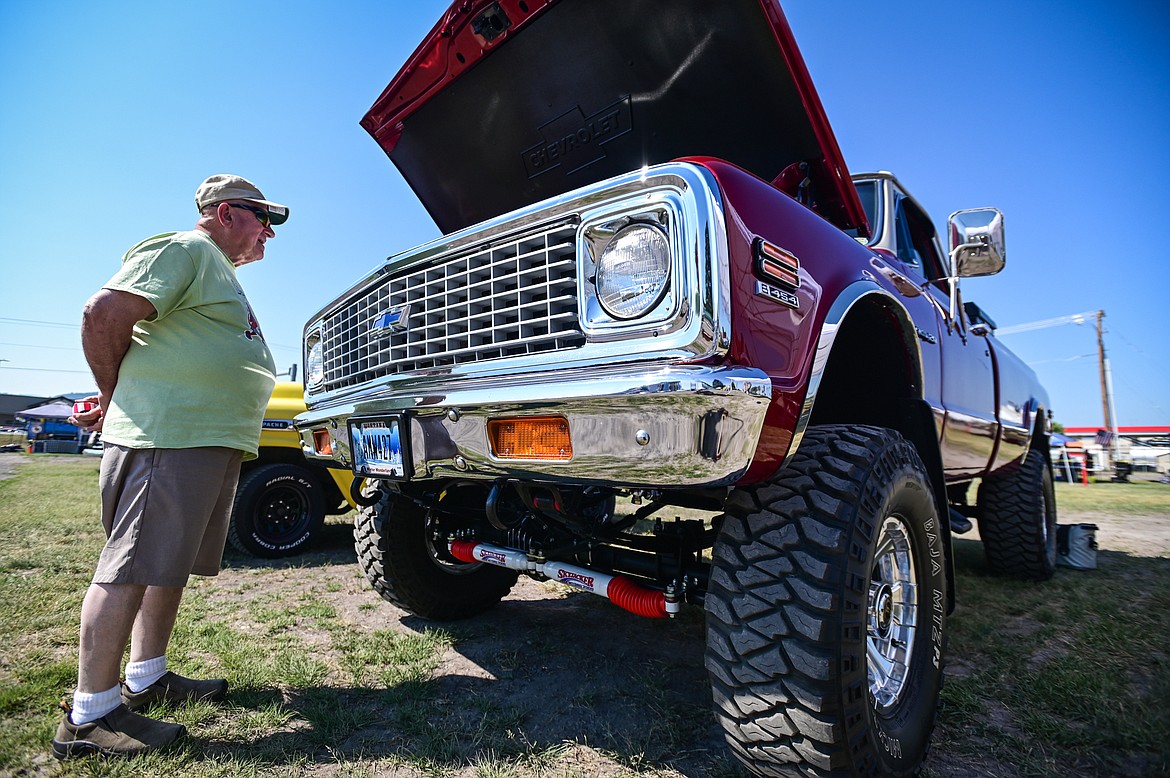 Richard Frisk, with the Knights of Columbus, takes a look at a 1971 Chevy K20 pickup at the Knights of Columbus Brisket Showdown at the Flathead County Fairgrounds on Saturday, July 30. (Casey Kreider/Daily Inter Lake)