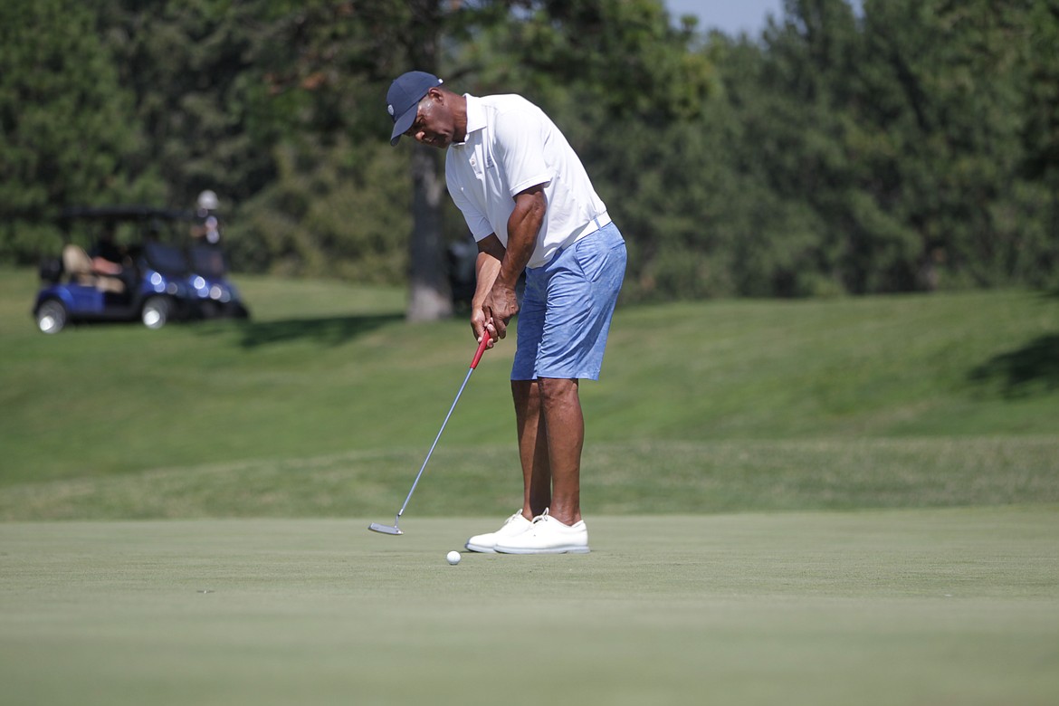 JASON ELLIOTT/Press
Former NFL great Marcus Allen putts on the 18th green during Saturday's Showcase golf exhibition at The Coeur d'Alene Resort Golf Course.