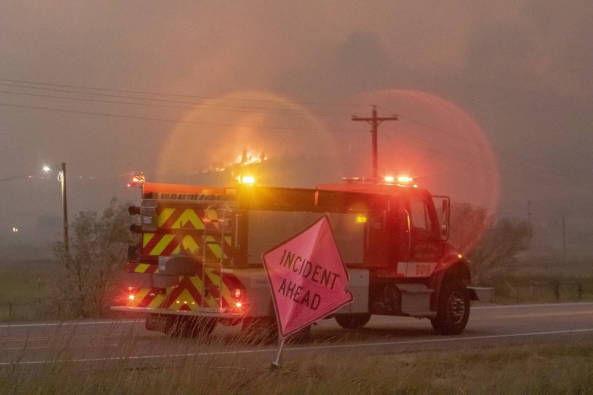 Fire crews respond to the Elmo Fire west of Flathead Lake on Friday night. (Rob Zolman/Lake County Leader)