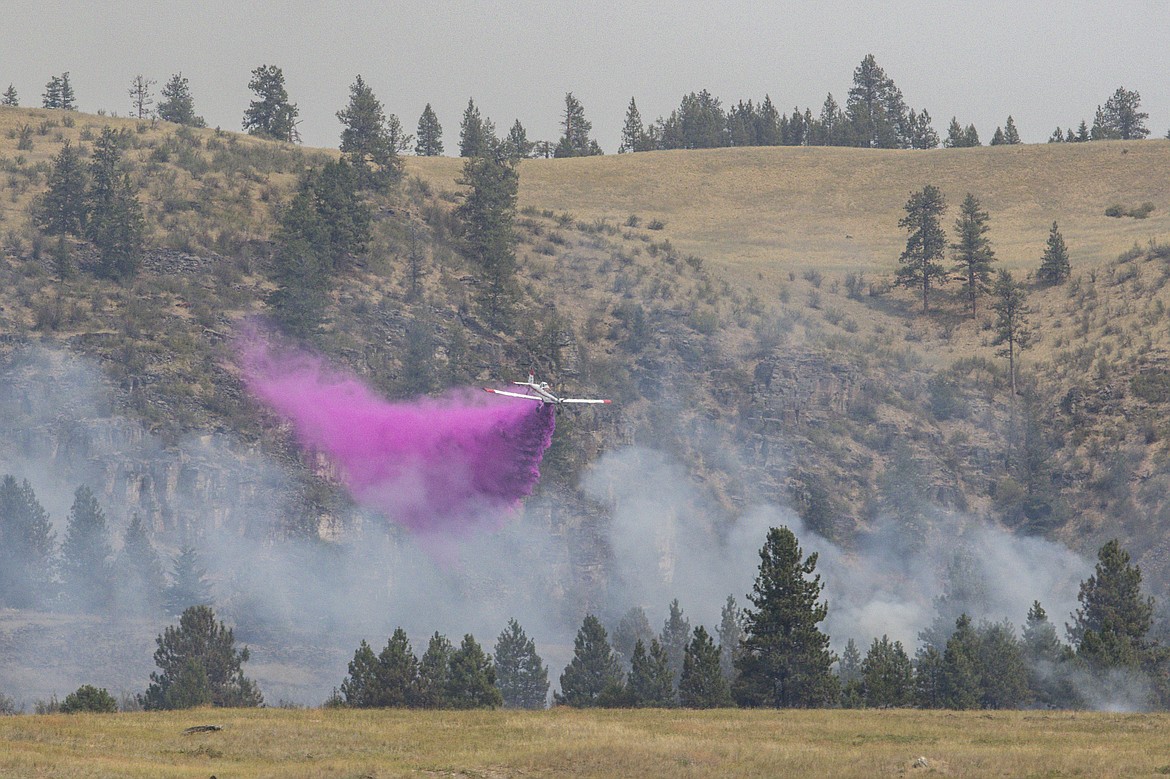 Fire retardant is dropped on the Elmo Fire burning west of Flathead Lake near Elmo on Saturday, July 30, 2022. (Rob Zolman/Lake County Leader)