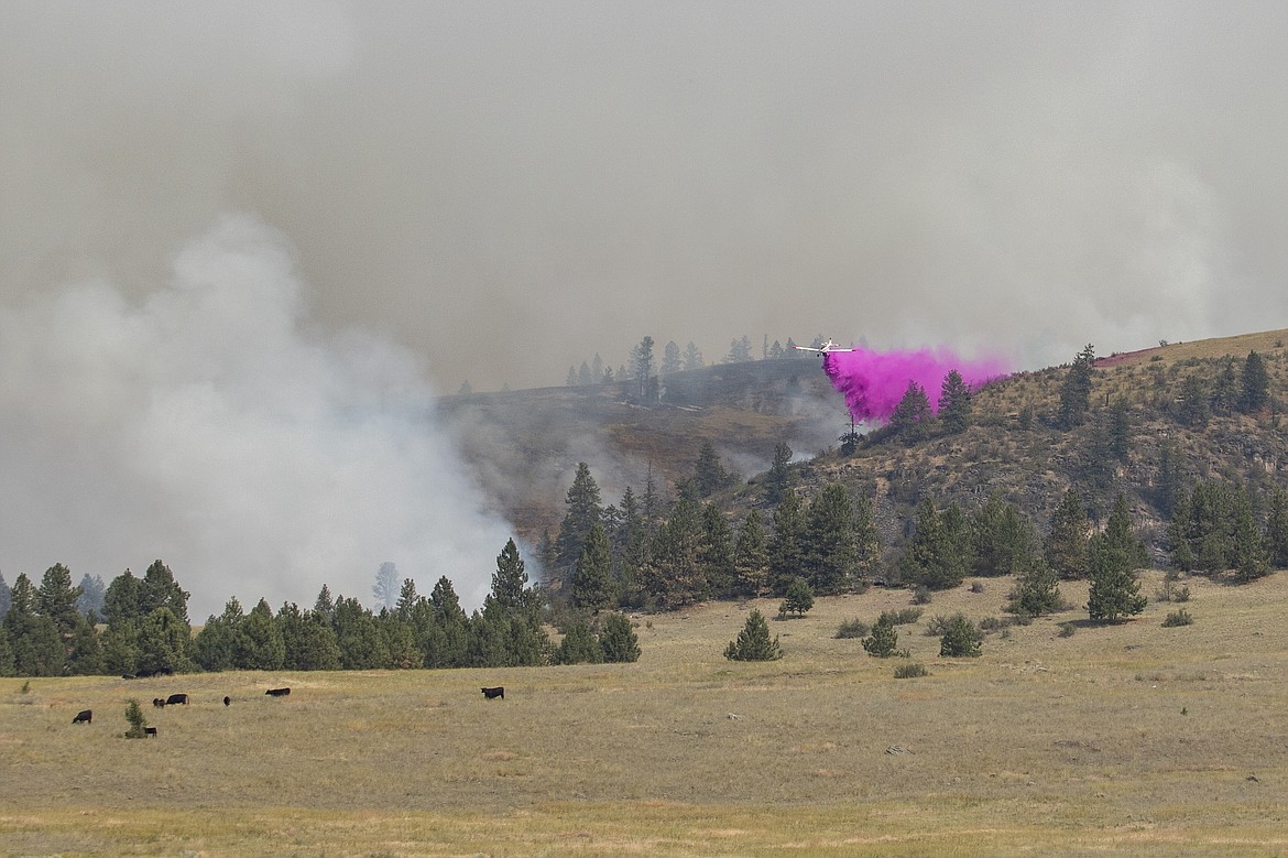 Fire retardant is dropped on the Elmo Fire burning west of Flathead Lake near Elmo on Saturday, July 30, 2022. (Rob Zolman/Lake County Leader)