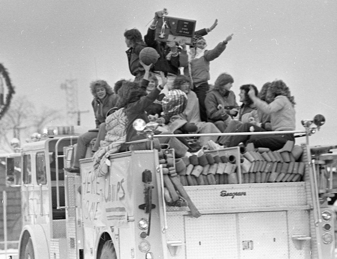 The Wildkats got the obligatory championship firetruck ride through Columbia Falls. (Photo courtesy of Hungry Horse News).