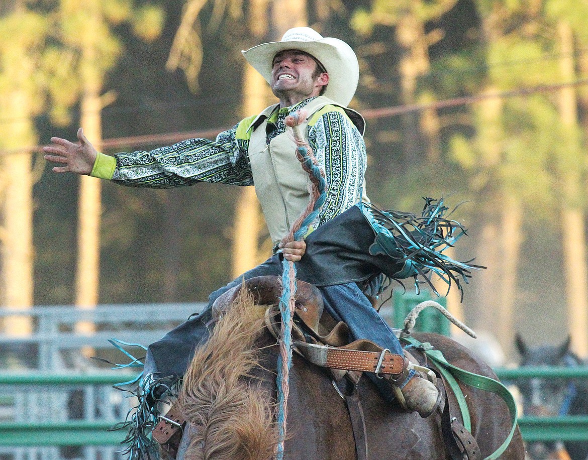 Keegan Thomas of Helena aboard "Boy Toy" in the saddle bronc event Friday evening at the Kootenai River Stampede. (Paul Sievers/The Western News)
