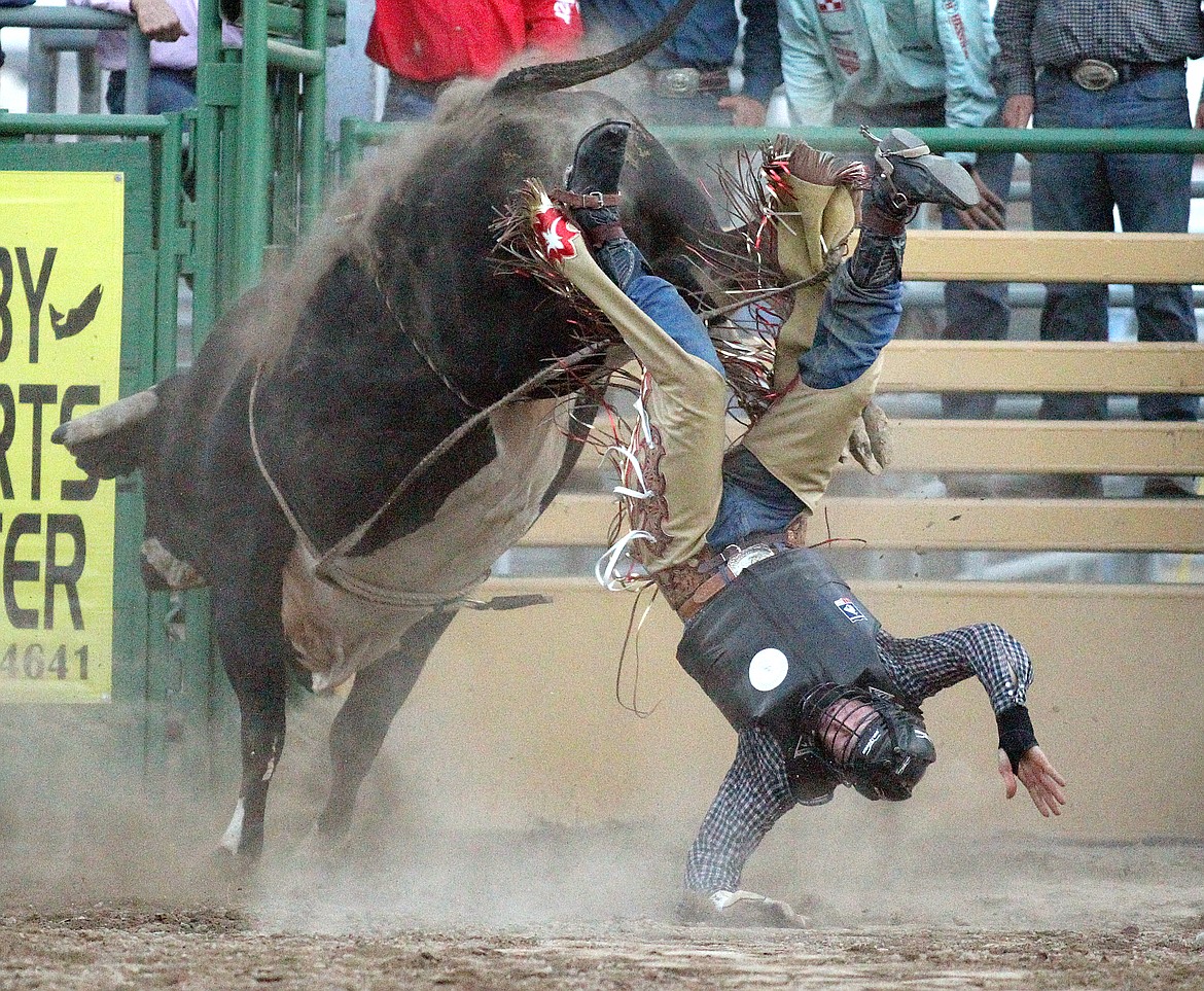 Luke Gee of Stanford exits the bull known as "Ghost Dancer" Friday evening at the Kootenai River Stampede. (Paul Sievers/The Western News)
