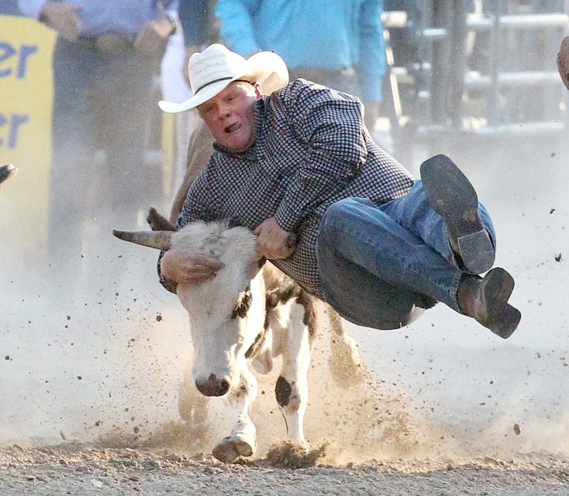 Riley Joyce of Geraldine with a time of 10.7 in Friday's steer wrestling event at the Kootenai River Stampede. (Paul Sievers/The Western News)