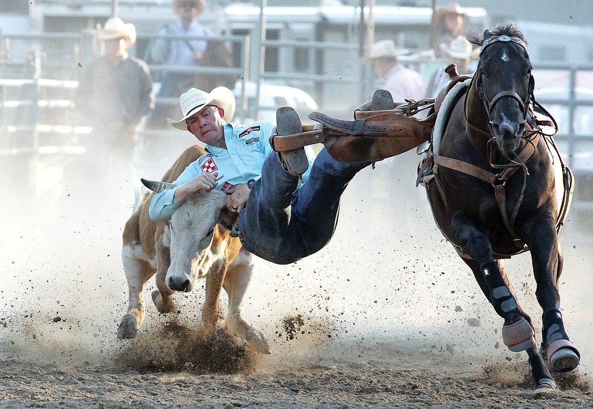 Helena's Ty Erickson scores a 17.9 in the steer wrestling event Friday evening at the Kootenai River Stampede. (Paul Sievers/The Western News)