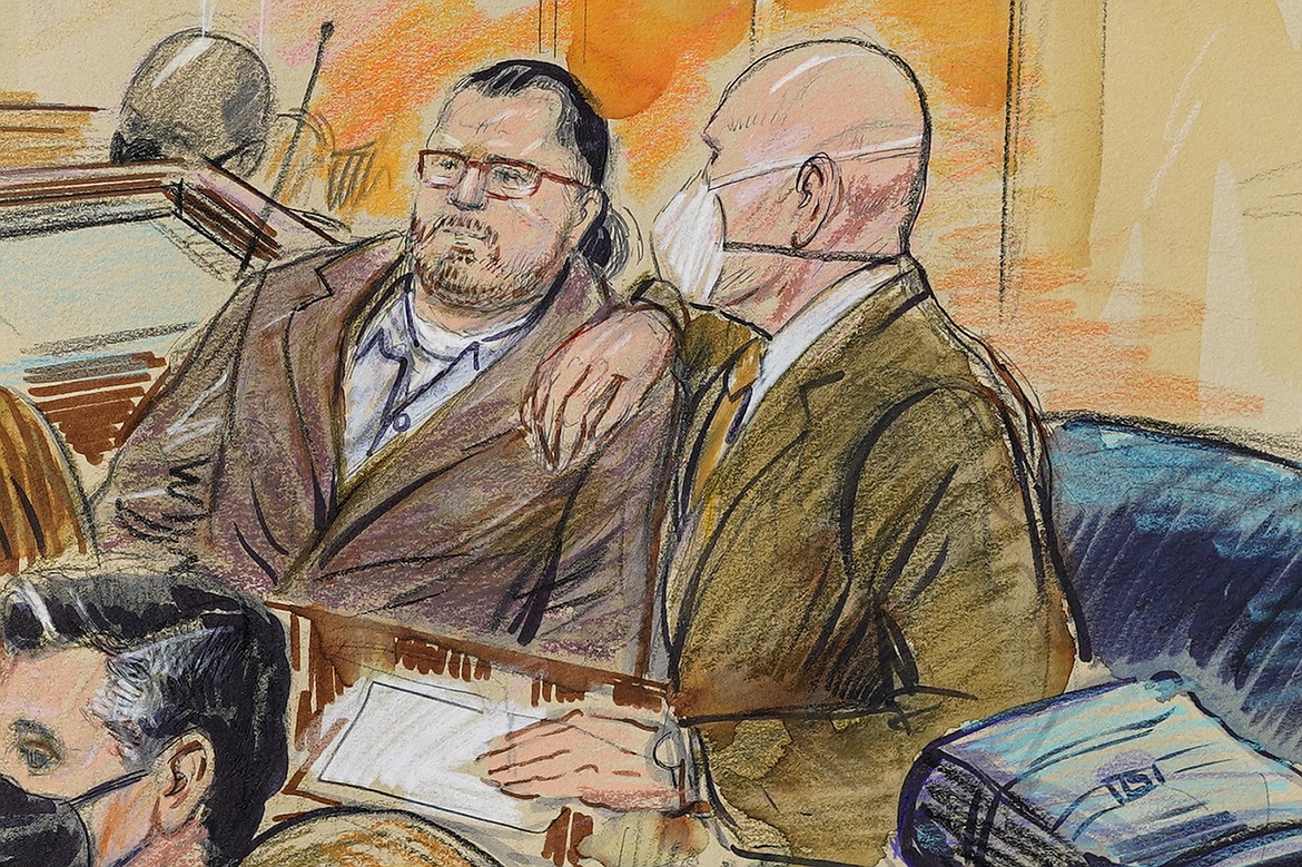 This artist sketch depicts Guy Wesley Reffitt, joined by his lawyer William Welch, right, in Federal Court, in Washington, on Feb. 28, 2022. Reffitt, convicted of storming the U.S. Capitol with a holstered handgun helmet and body armor was sentenced on Monday to 87 months — more than seven years — in prison. It's the longest sentence imposed so far among hundreds of Capitol riot cases. (Dana Verkouteren via AP, File)