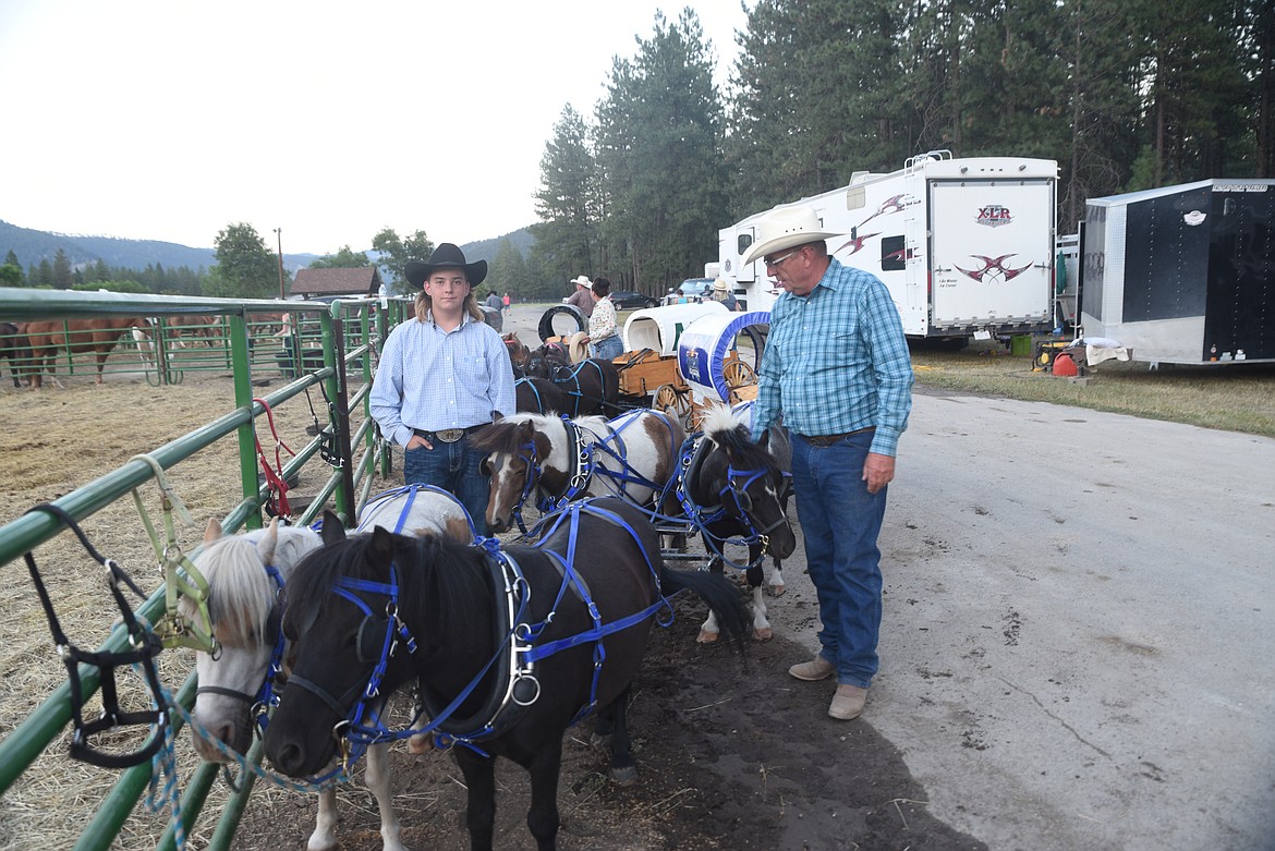 Carl Earl, right, and Tyson Bier, prepare for the finale of the Alberta Miniature Chuckwagon races Saturday night at the Kootenai River Stampede. (Scott Shindledecker/The Western News)