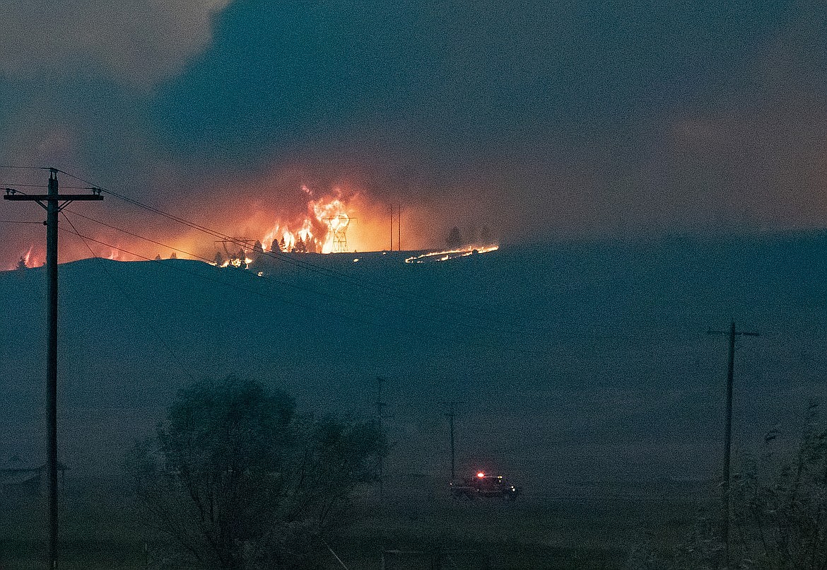 The Elmo 2 Fire burns near high voltage power transmission lines west of Flathead Lake near Elmo on Friday, July 29, 2022. The fire had burned about 4,000 acres by Saturday morning, July 30. (Rob Zolman/Lake County Leader)