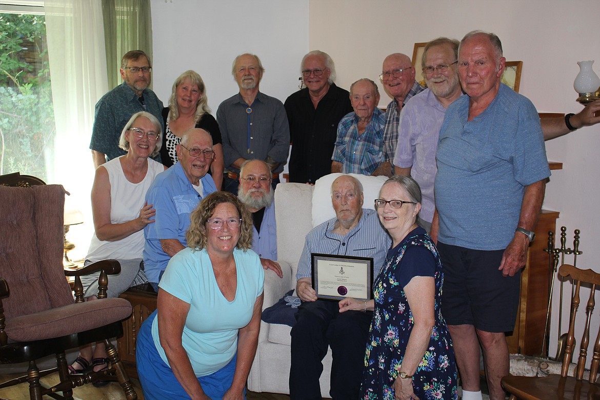 Joe Magone, seated, was surprised when friends, family and Masons held a small celebration for his as he was officially inducted into the Montana Masonic Hall of Fame July 31.