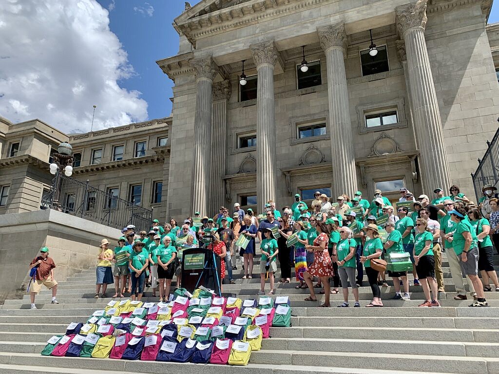 Teacher Leah Jones speaks to Reclaim Idaho volunteers and supporters on July 6, 2022, at the Idaho State Capitol.