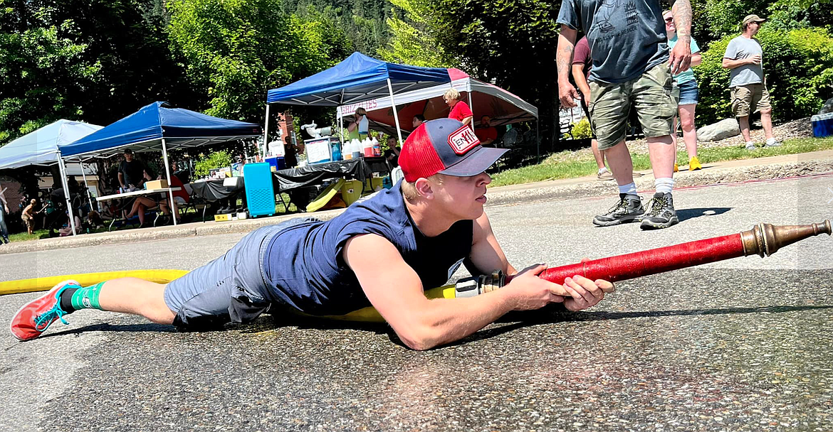 Sean Detwiler with Shoshone County Fire District No. 1 prepares to fire a water hose at the Make-and-Brake competition targets.