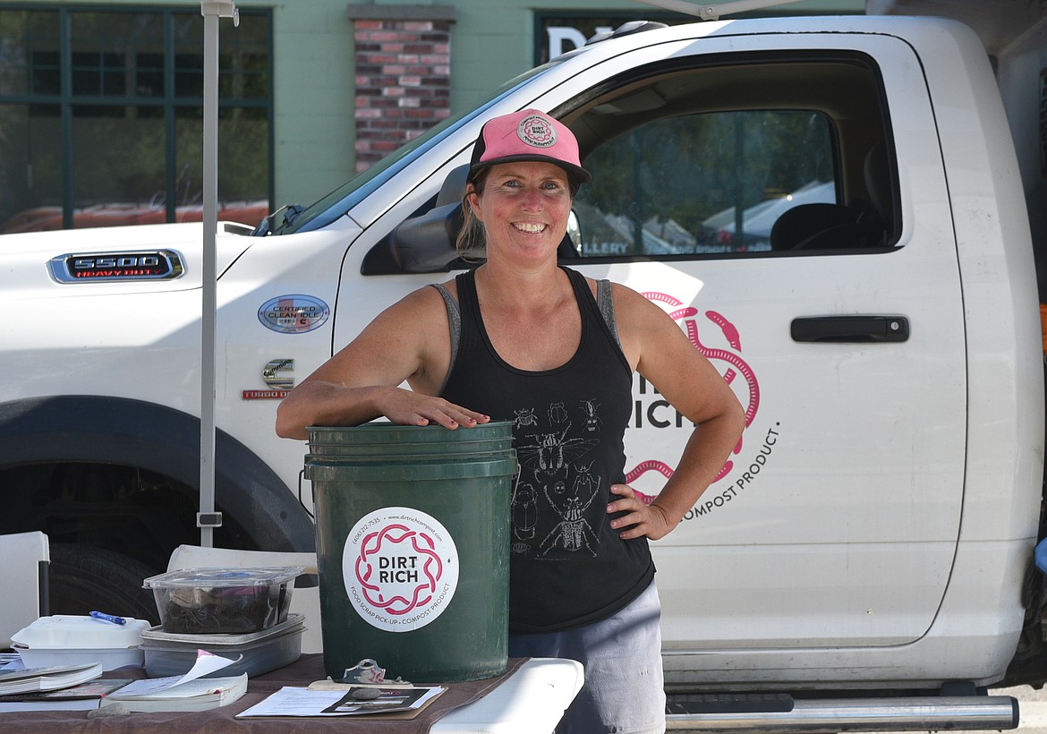 Krista Fischlowitz with Dirt Rich Compost works at the Whitefish Farmers' Market, a Zero Waste Event, downtown on a recent Tuesday evening, collecting compostable materials and answering questions about the composting process and products. (Julie Engler/Whitefish Pilot)