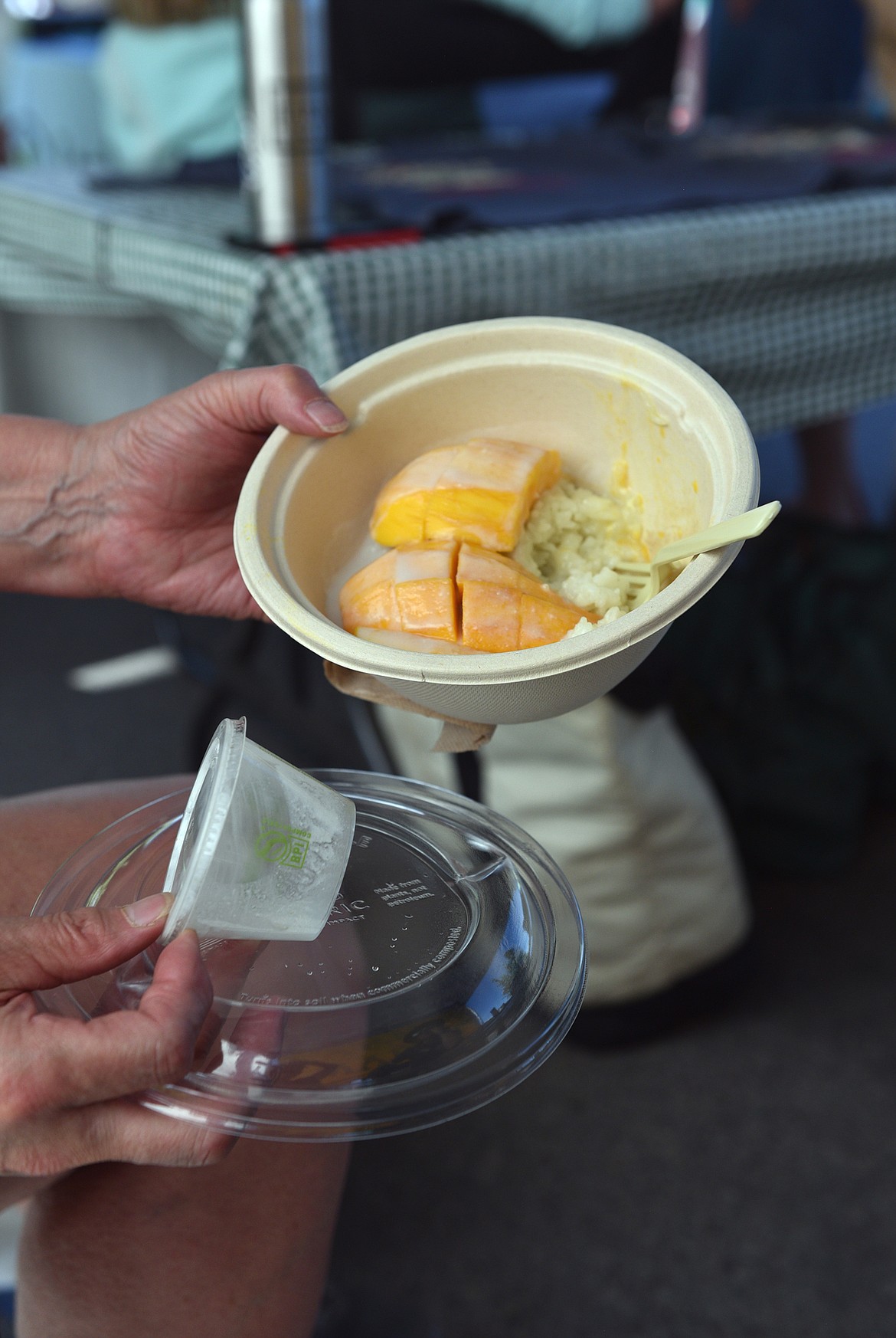The containers can look sophisticated and even "plastic-like" but all the dishes and utensils purchased at Whitefish Farmers' Market are compostable, along with any food scraps. (Julie Engler/Whitefish Pilot)