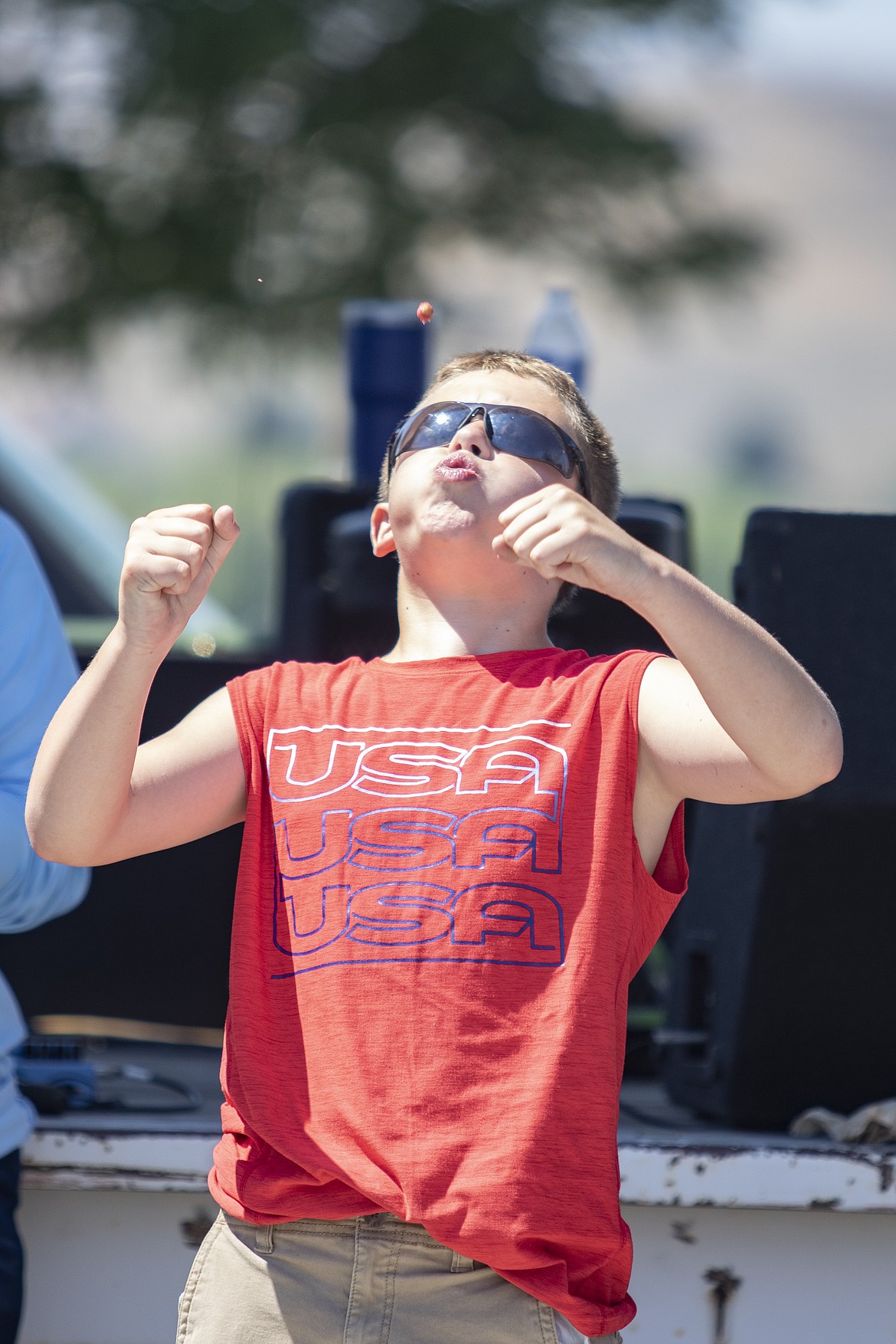 Participant takes aim in 2022 cherry pit-spitting contest at the Flathead Cherry Festival in Polson. (Lake County Leader file photo)