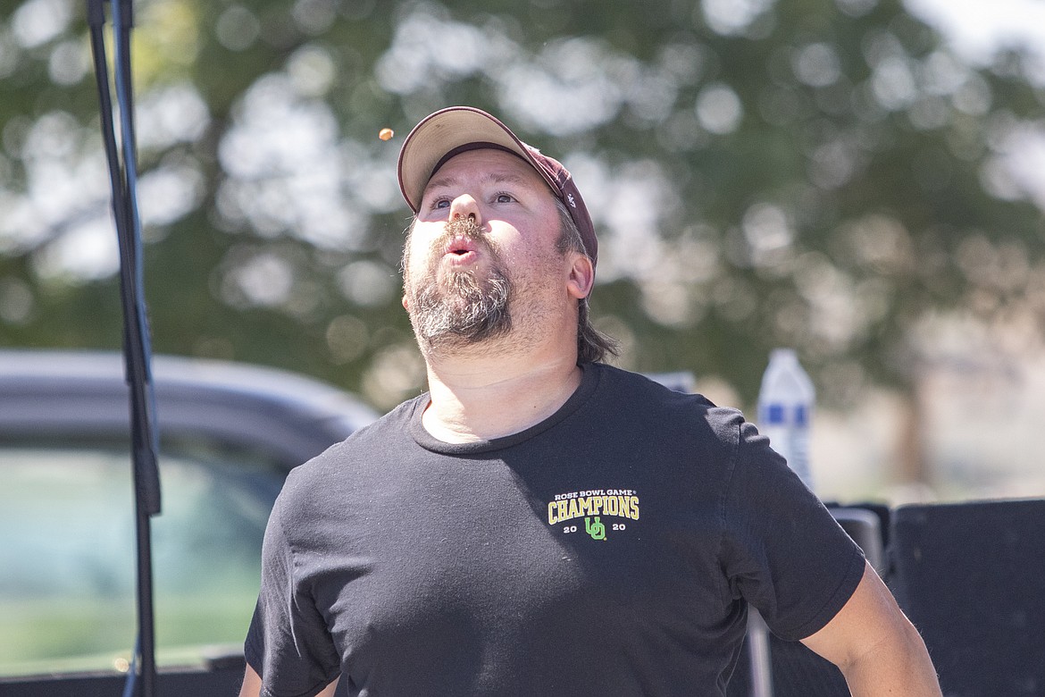 Participants in the cherry pit spitting contest at the Flathead Cherry Festival in Polson on Saturday. (Rob Zolman/Lake County Leader)